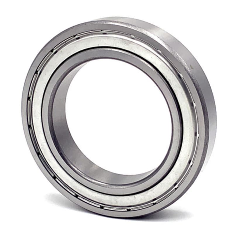 Close-up of a bearing being sprayed with WD-40