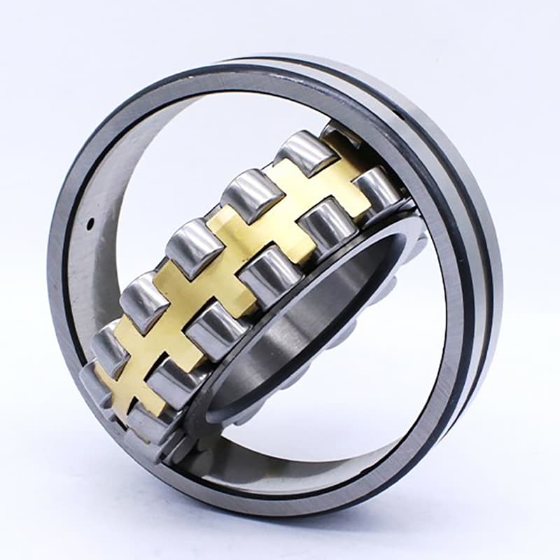 Technician greasing a spherical roller bearing