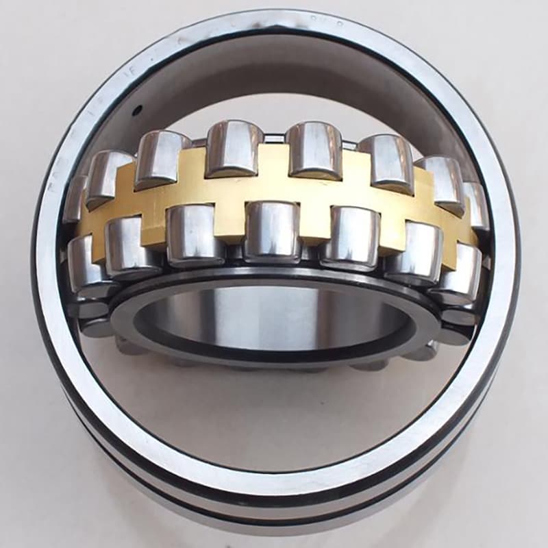 Quality inspector testing a bearing on a vibration analyzer in an import warehouse