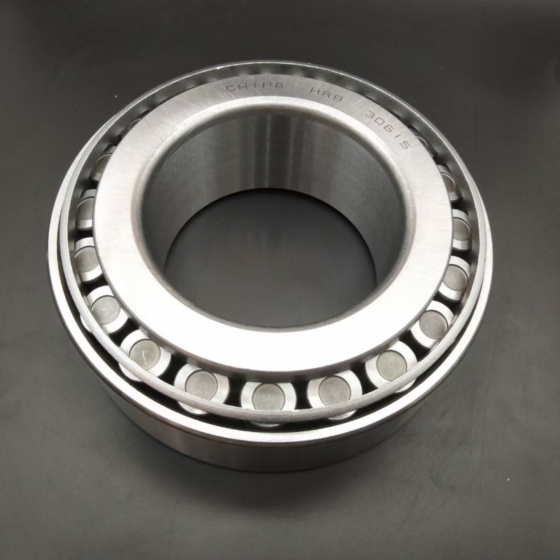 High-load tapered roller bearing supporting a massive industrial gear shaft