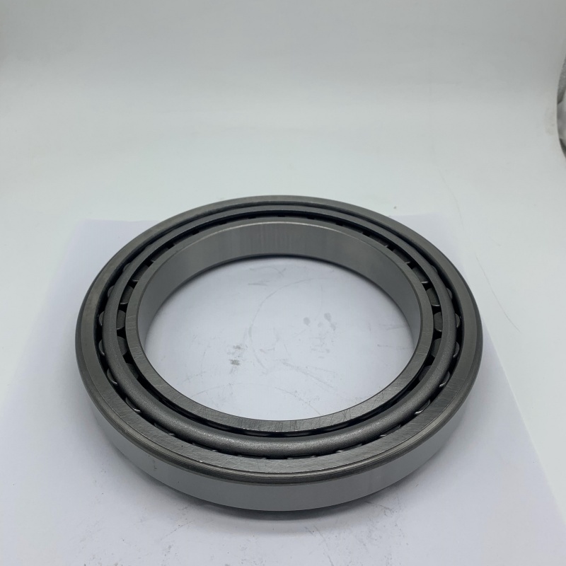 alt: Diagram showing radial and thrust loads on a tapered roller bearing